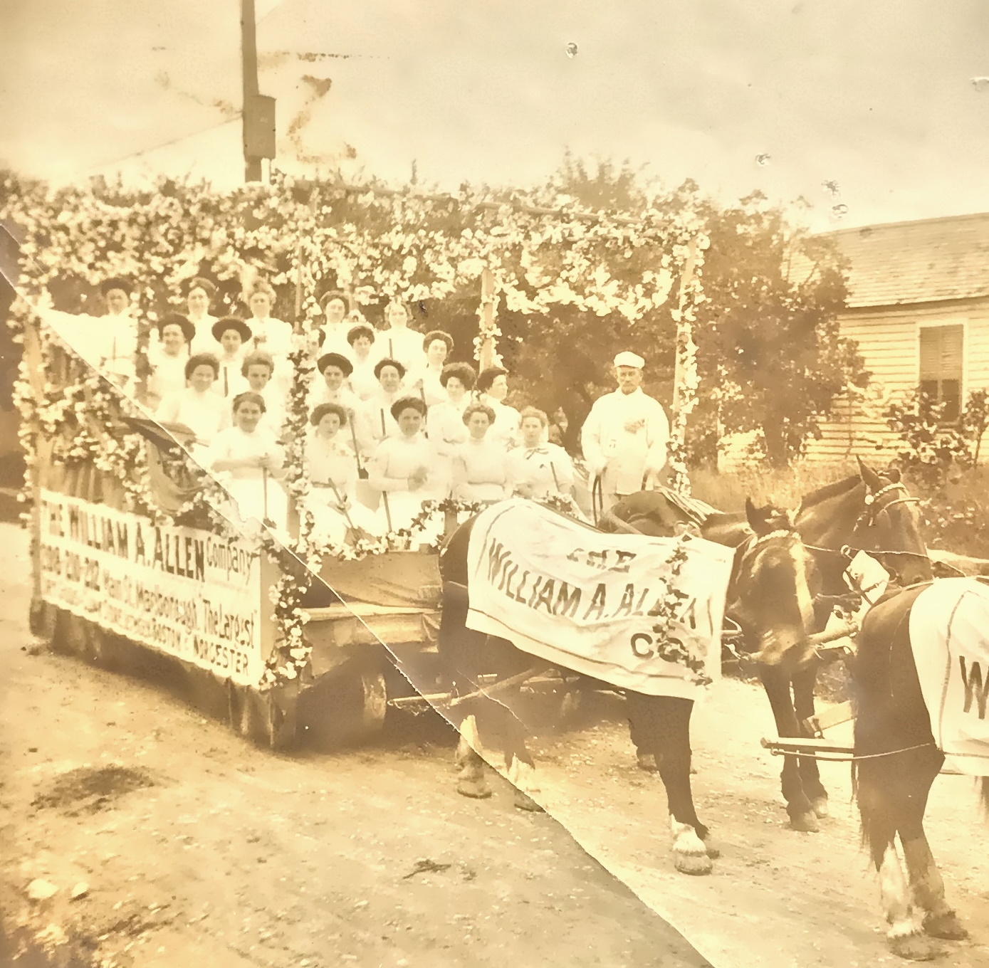 A horse-drawn carriage parading some of the William A. Allen Co. workers from the Marlboro store.